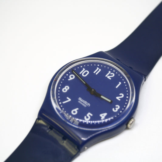 Blue Swatch watch on a white background