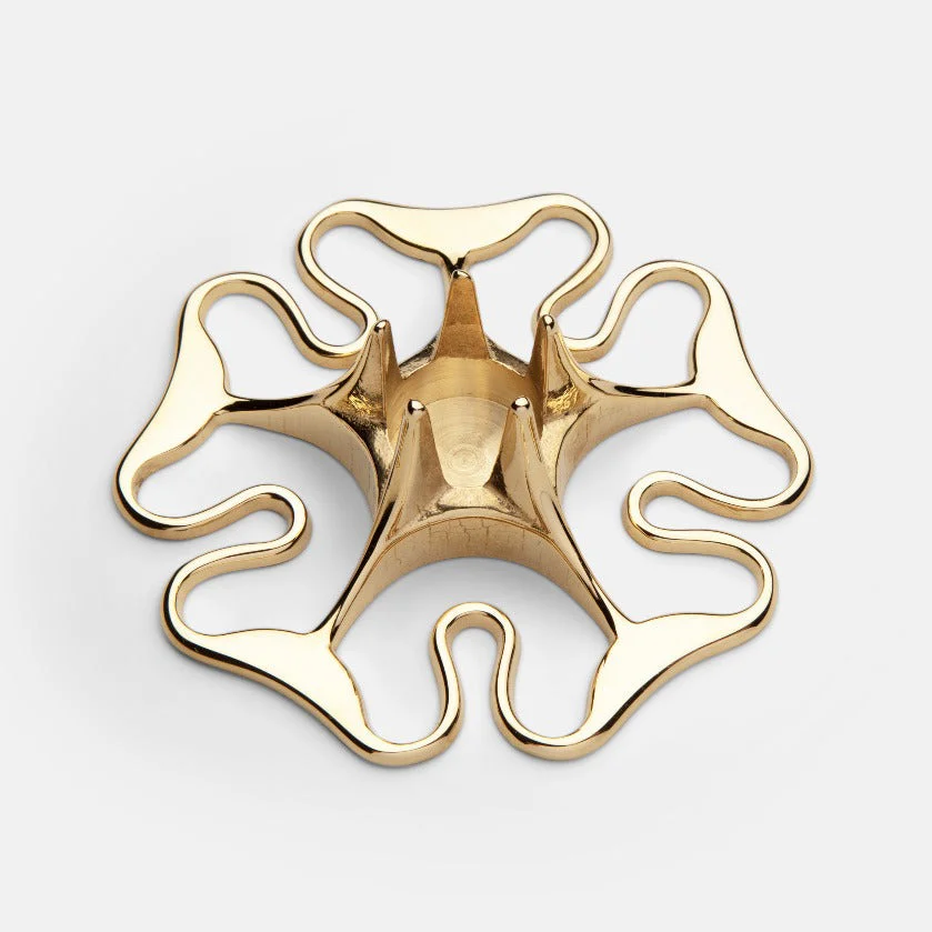 Brass candle holder on a white background