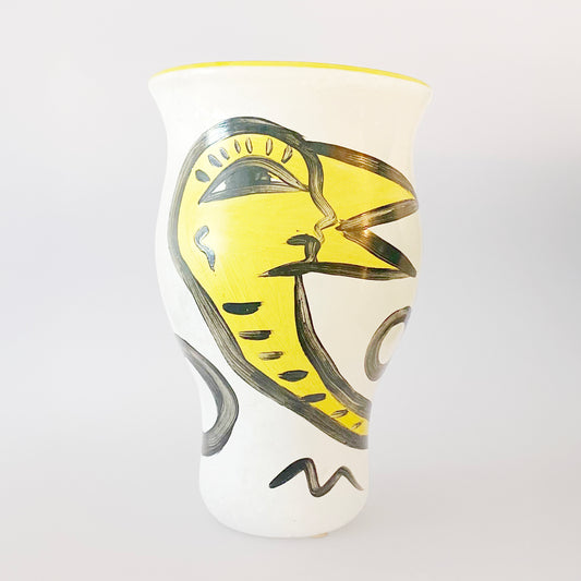 Decorative glass vase with artistic design on a white background