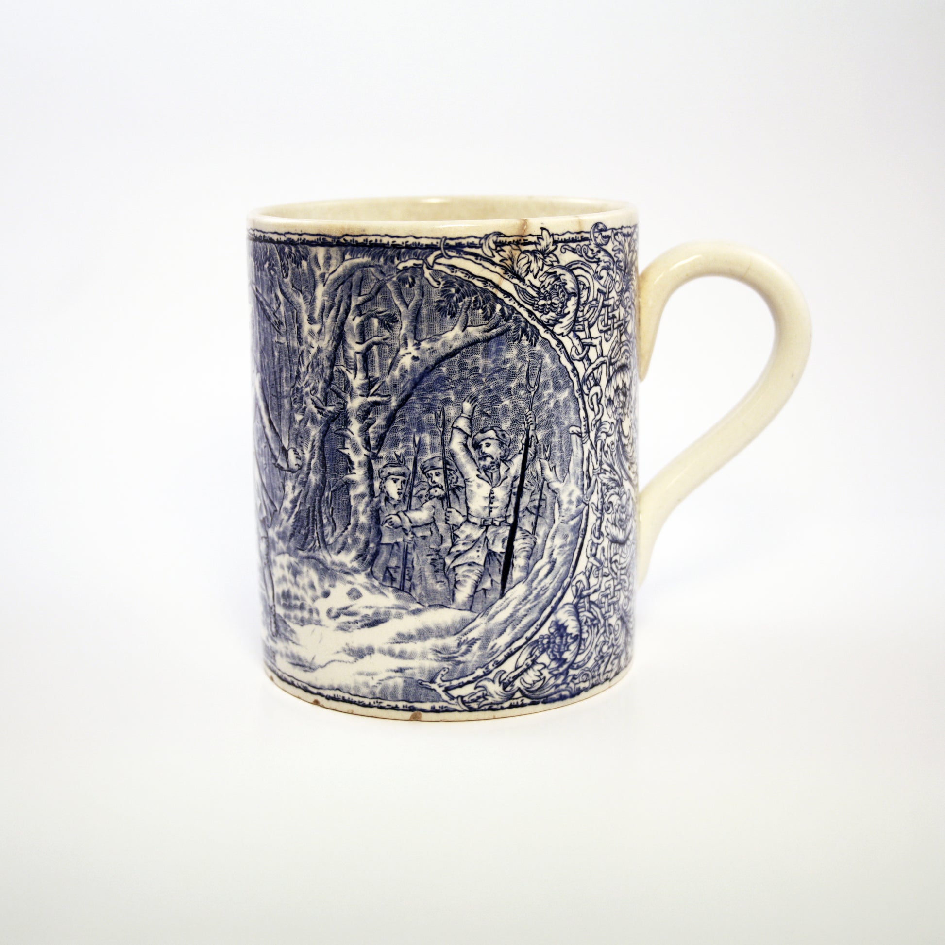 Ceramic mug with blue forest design on a white background