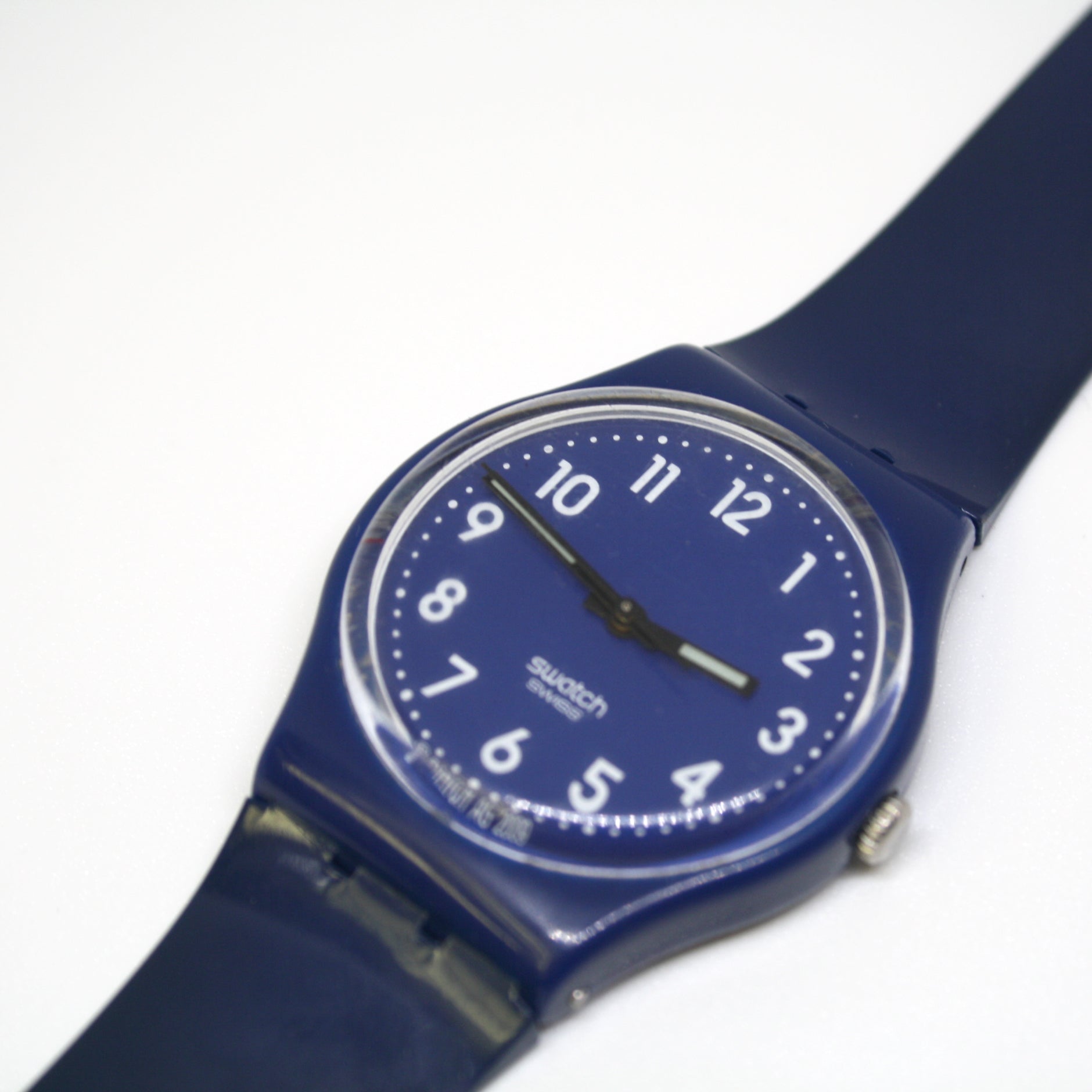 Blue Swatch watch on a white background