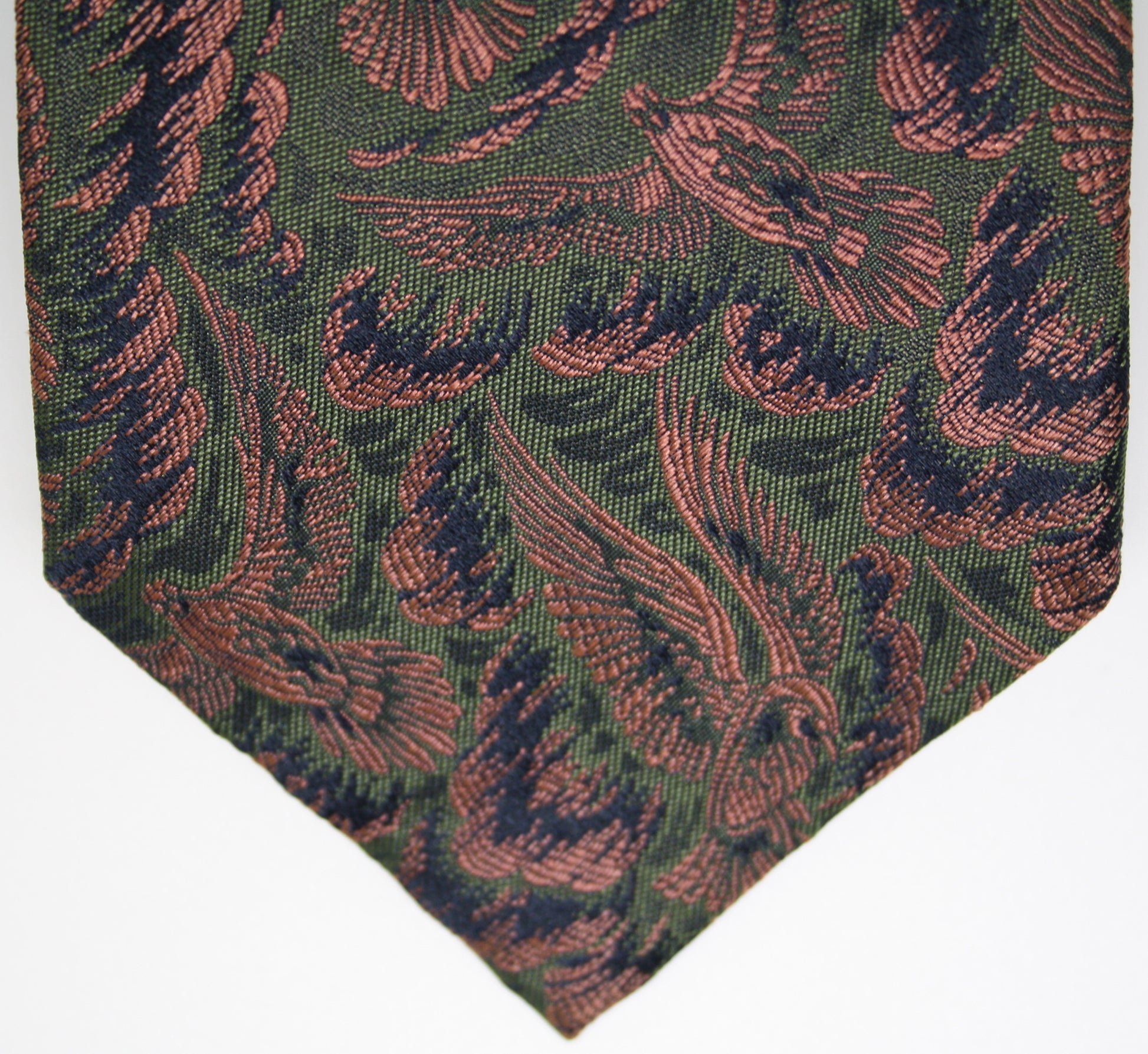 Green tie with red and green pattern on a white background