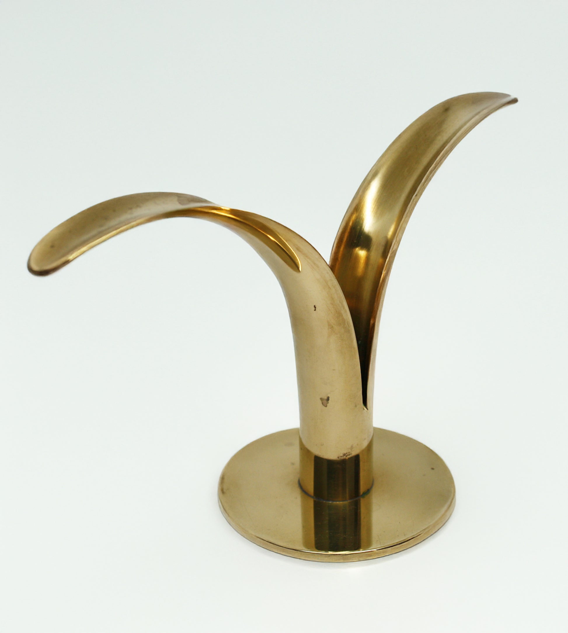 Brass candle holder on a white background