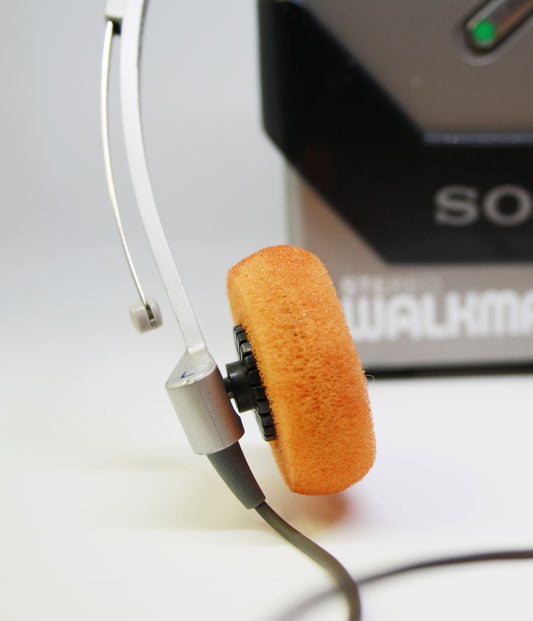 Close-up of a Sony orange earpiece