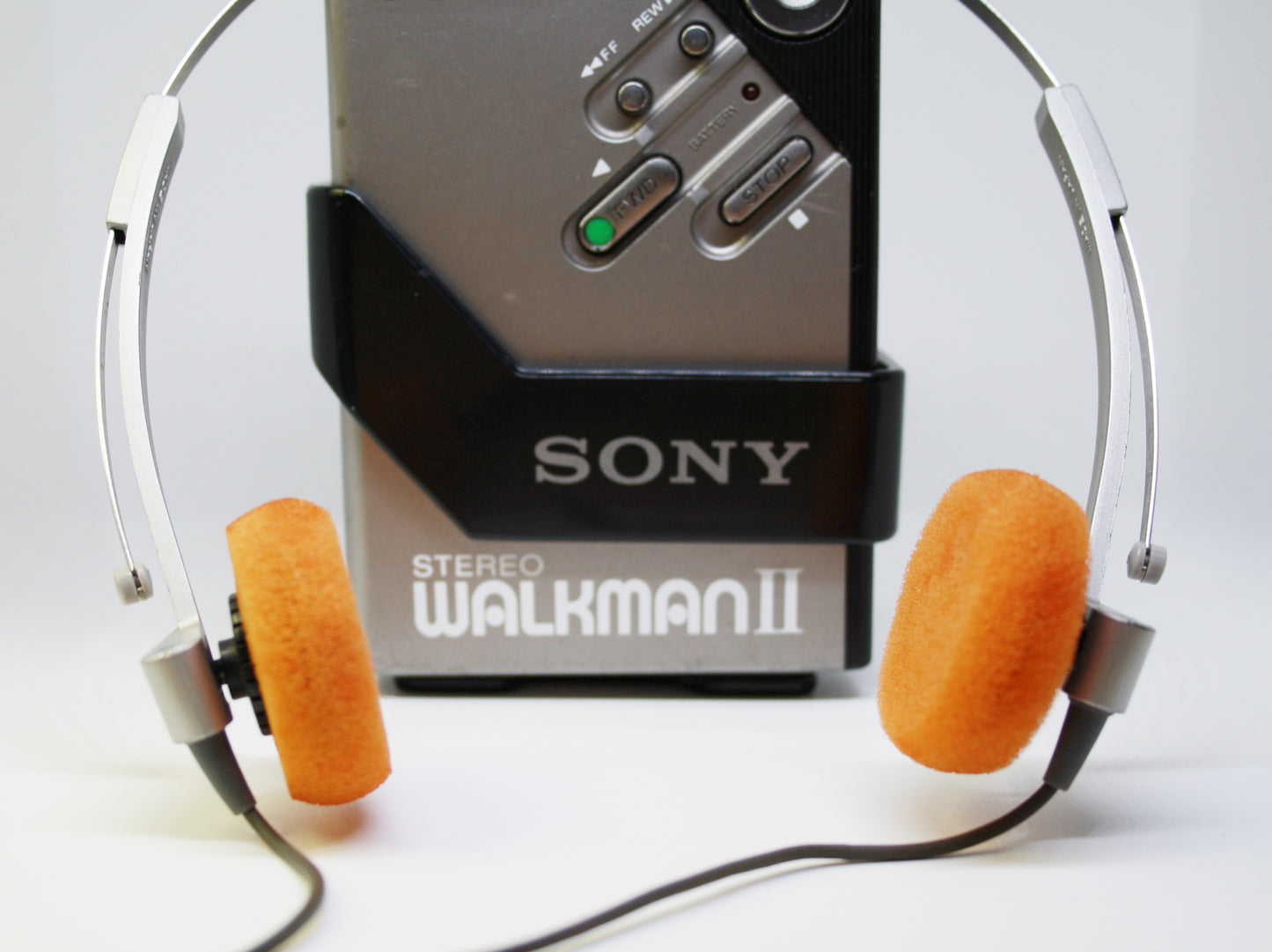 Sony Walkman II with headphones on a white background